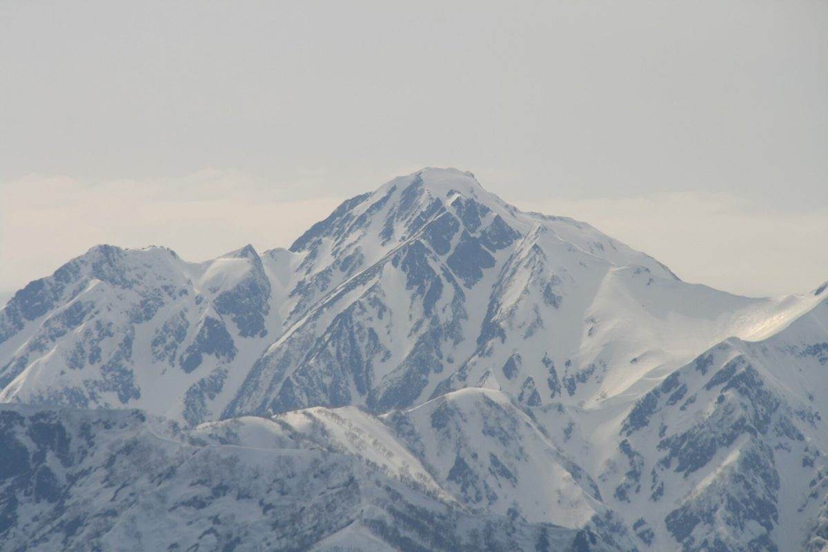 The snow-covered summit of Mount Goryu above Hakuba Valley