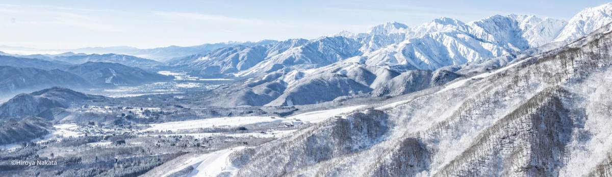 Hakuba Valley in winter, with the ski slopes and the Northern Japan Alps behind