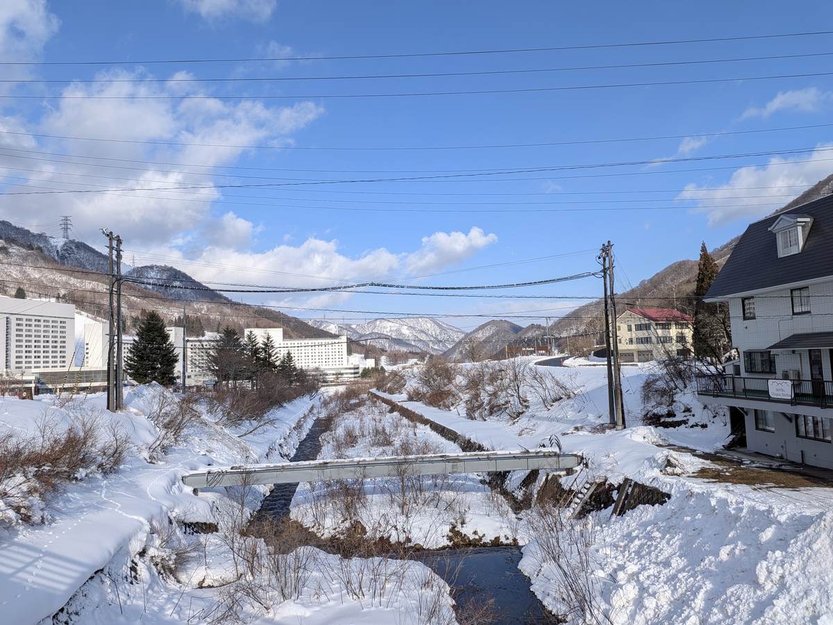 Snow-covered slopes and lift towers at Naeba Ski Resort, Niigata