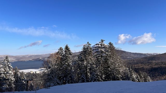Frozen Lake Akan seen from the piste at Akan Lakeside ski area, Hokkaido