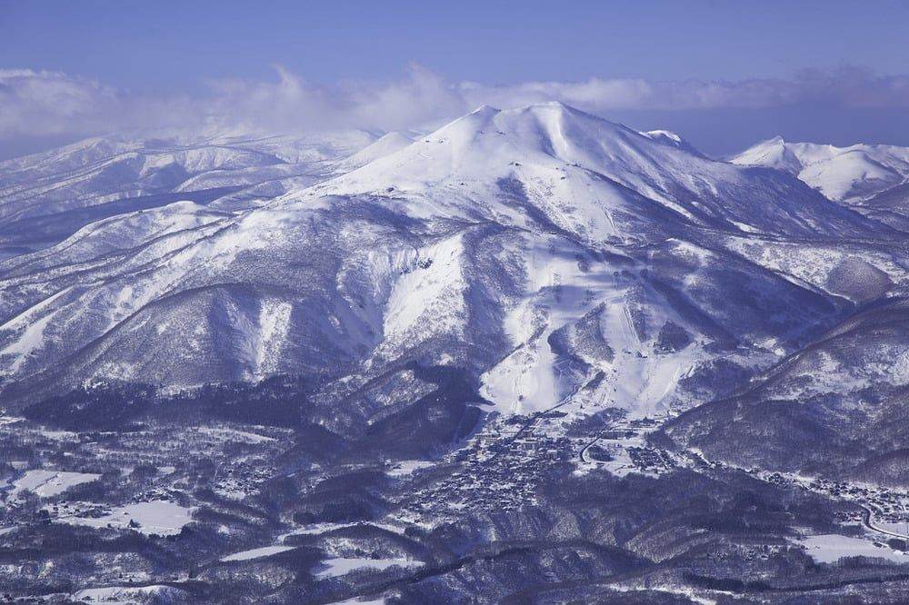 Aerial view of Mt Annupuri with the Niseko resorts and villages spread across its slopes